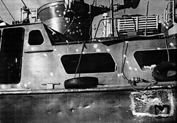 Photo of Peck's Swift Boat after being fired upon.