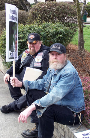 Stan Strange (right) protesting DA Campbell