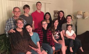 The Parker family from left to right back row: Charley, Isaac, Adam, Faith, Megan, David holding Olivia - Front row from left to right: Kate, Joshua, Emily and Sarah